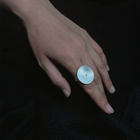 "Flowing Stream" silver ring features clear, even, and clean water ripple patterns