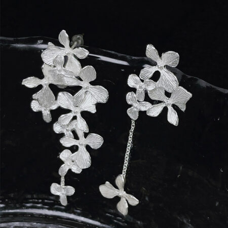 "Blooming Flowers" Handcrafted Silver Earrings feature an asymmetric design that appears effortless but is meticulously crafted for a natural look
